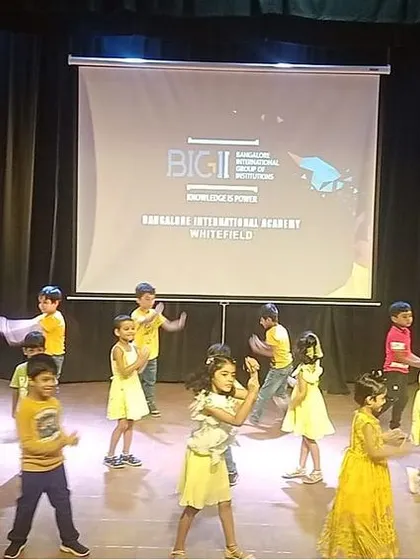 Our youngest campers, dressed in yellow, perform a delightful dance on stage, showing their newfound confidence.