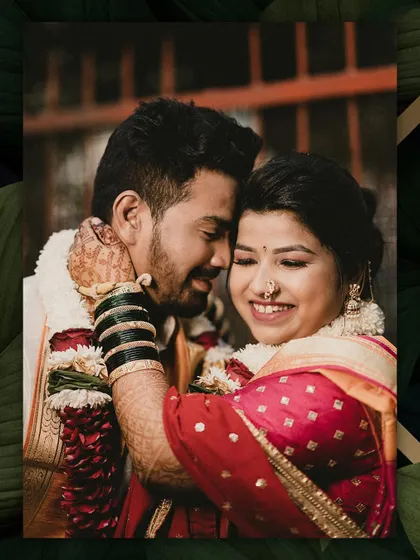 A joyful, candid embrace. The bride's genuine smile is infectious as she hugs her groom, a perfect capture of their happiness.