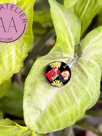 A way to keep faith close. I preserved a Guruji swaroop in this custom resin keychain, surrounded by yellow flowers against a black background.