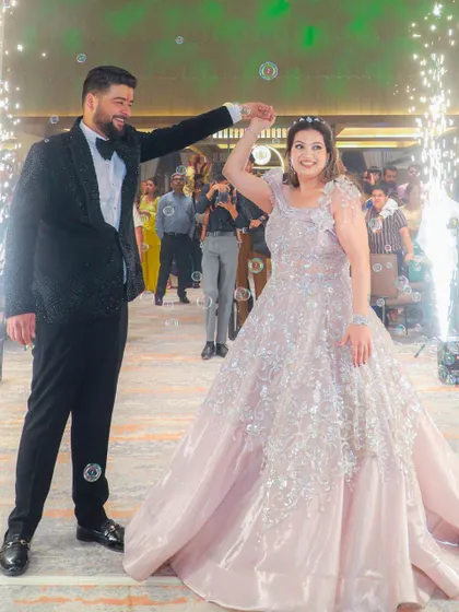 A magical moment on the dance floor. The bride's makeup is designed to be long-lasting and photo-ready, even with sparklers and bubbles.