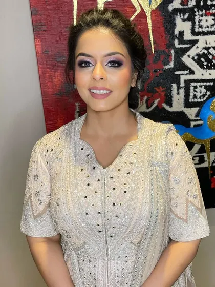 A happy client with her perfectly blended smokey eye makeup, ready for the festivities.