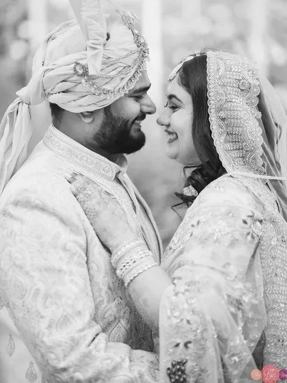 The happy portrait of Abhiram and Ayushi, rendered in classic black and white, gives it a timeless, heirloom quality.