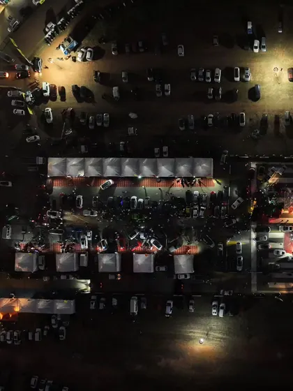 A closer top-down shot of the expo area, buzzing with activity even after the sun goes down. The energy at Vroom never stops.