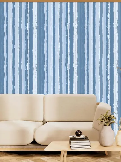 A similar painterly stripe pattern, this time in calming shades of blue. This design from the Polo collection is perfect for creating a serene and relaxed living space.