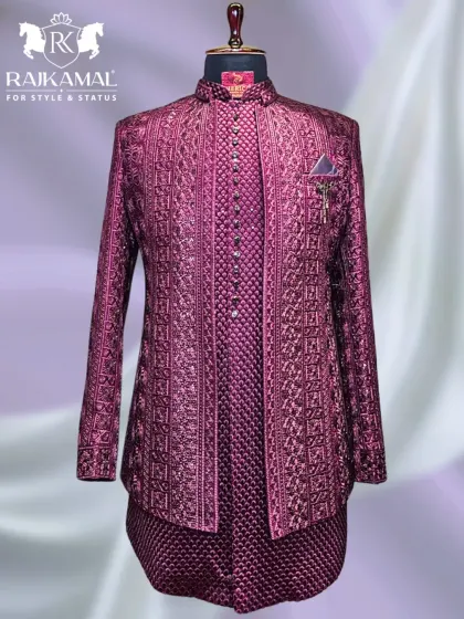 I love working with rich, bold colors. This layered Jodhpuri ensemble in a deep magenta features intricate, tone-on-tone embroidery, creating a look that is both majestic and perfect for a Sangeet or reception night.