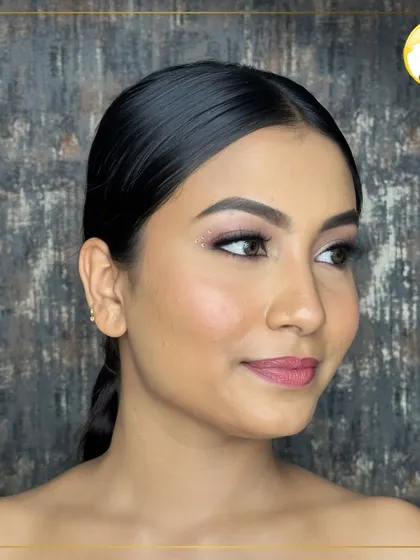 This is a beautiful example of a minimal glam look. The focus is on radiant skin, subtly defined eyes, and a natural pink lip, perfect for clients who prefer an understated style.