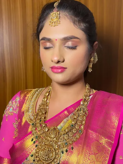A close-up of a soft, pink-toned bridal makeup look. This unfiltered image shows the clean blending of the eyeshadow and the natural-looking skin finish.