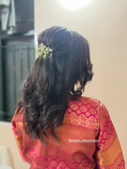 A side view of the soft curls and half-updo. This is a versatile hairstyle that works beautifully for engagements, receptions, or even for bridesmaids.