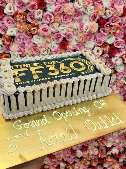 A corporate cake for the grand opening of a fitness company. I can print any logo or branding directly onto the cake for business events.