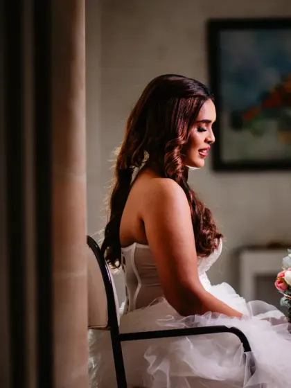 A quiet, contemplative portrait of the bride, beautifully lit, just before she leaves for the ceremony.