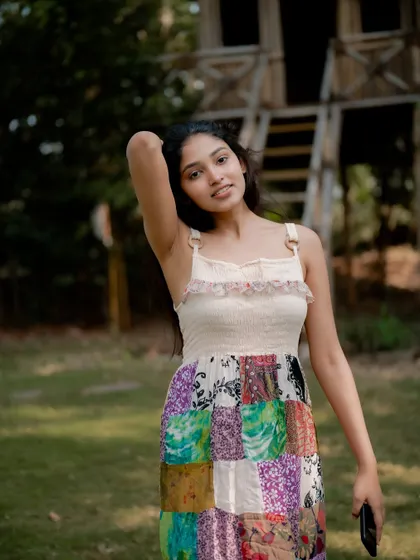 A duplicate of image 221, this candid and joyful portrait of actress Rachana Inder in a park is full of natural beauty.