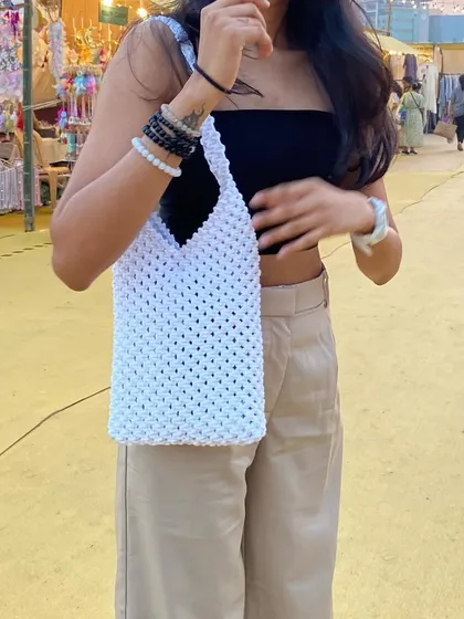 Our macrame shoulder bag is a versatile piece that complements any casual outfit. We can customize the size and color to your liking.