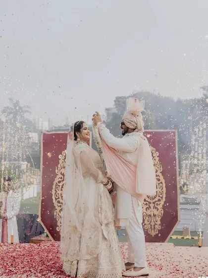 The couple celebrates their union with a dance on the varmala stage, as cold pyros sparkle around them. It's a moment of pure celebration and joy.