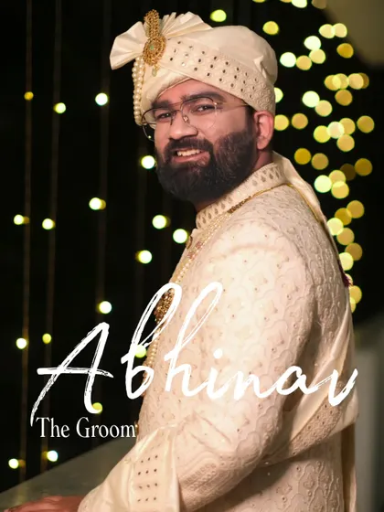 A portrait of the groom, Abhinav, looking dapper and ready for his big day. The bokeh lights add a celebratory feel to this classic wedding shot.