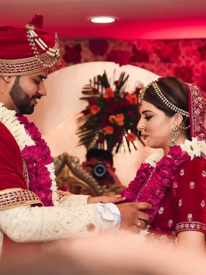 A moment from the Varmala ceremony, where the couple exchanges garlands, symbolizing their acceptance of each other.