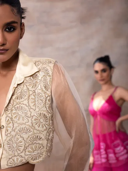 An artistic, layered shot for Akashi Clothing. The makeup on the model in the foreground is sharp and defined, creating a focal point and adding depth to the image.
