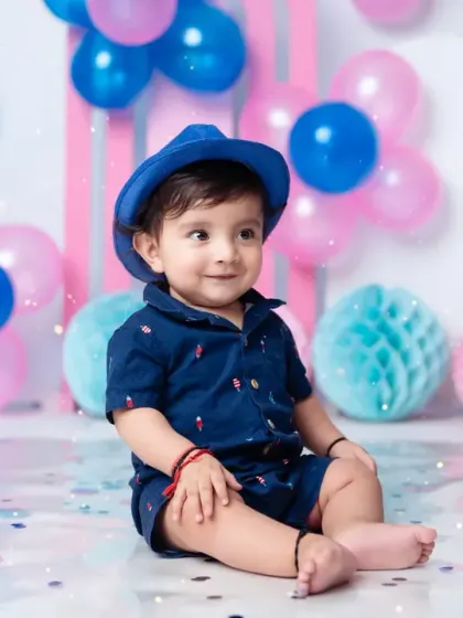 This little guy is looking sharp in his hat and matching outfit for his first birthday pictures.