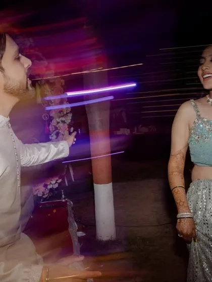 A fun, motion-blur shot from the Sangeet night, capturing the movement and energy of the dance floor.