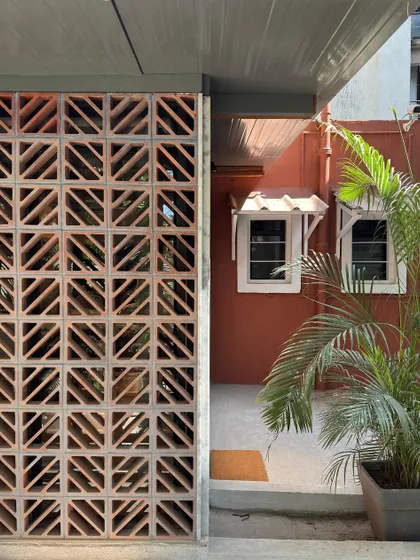 The terracotta jali facade of our studio extension filters the Mumbai sun, creating a beautiful play of light and shadow while keeping the interior cool. It's a modern application of a traditional Indian architectural element.