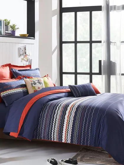 A beautifully styled shot of the complete bed set in a bright, sunlit room. This image serves as a perfect catalog or hero shot for the collection, showing all the components together.
