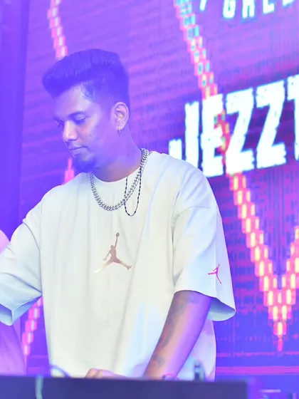 A candid shot of me at the decks, with the "JEZZTER" logo visible on the screen. This shows my presence as the featured artist for the night.