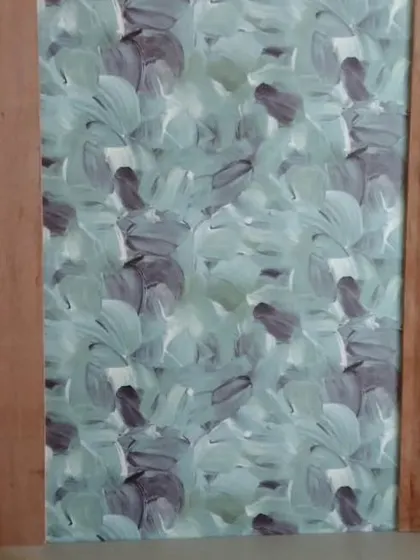 An abstract leaf-patterned wallpaper.