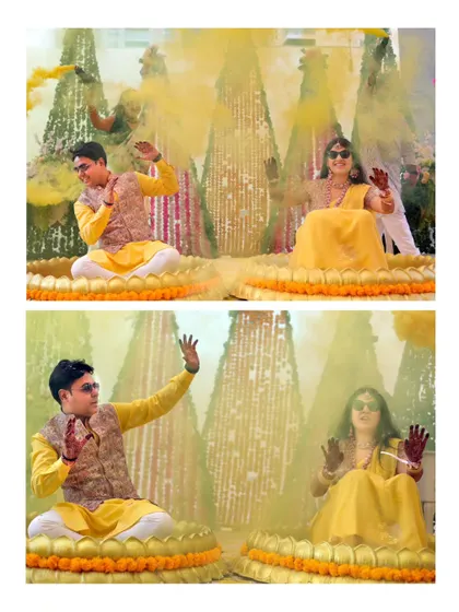 Another angle of the yellow smoke bomb shot, showing the couple's henna-stained hands and the vibrant celebration.