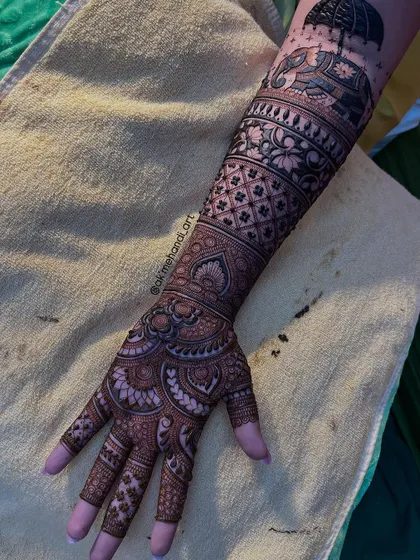 The full hand and arm view, showing how the elephant motif is part of a larger, intricate design.