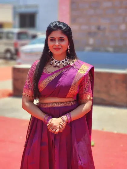 A beautiful purple half-saree or Langa Voni. This traditional outfit is perfect for cultural events and festive celebrations.