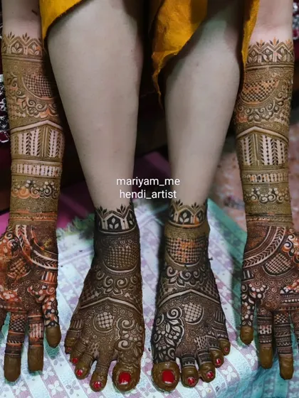 A full view of an Indian bridal mehendi, showcasing the beautiful coordination between hands and feet.