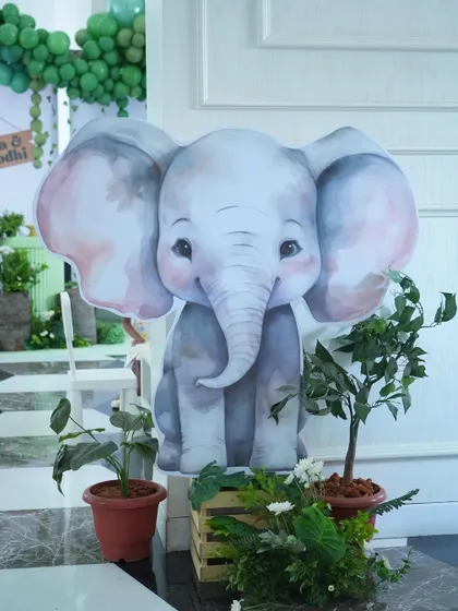 This adorable baby elephant cutout, nestled among potted plants, was a favorite photo spot for guests and added a sweet, gentle touch to the jungle theme.