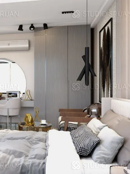 This close-up shows the cozy corner of the bedroom, with a vanity desk set in an arched nook and a modern, sculptural pendant light.