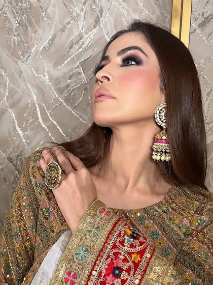 The final look is all about confidence. The intense smokey eye, paired with a traditional outfit and statement jhumkas, creates a powerful and unforgettable image for any festive campaign.