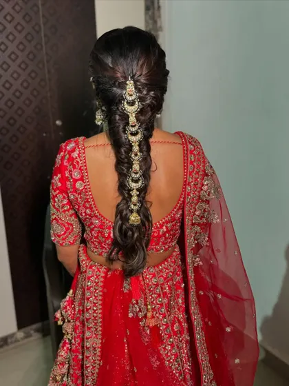 The full view of the decorated bridal braid, a perfect hairstyle for a traditional wedding look that is both elegant and secure.