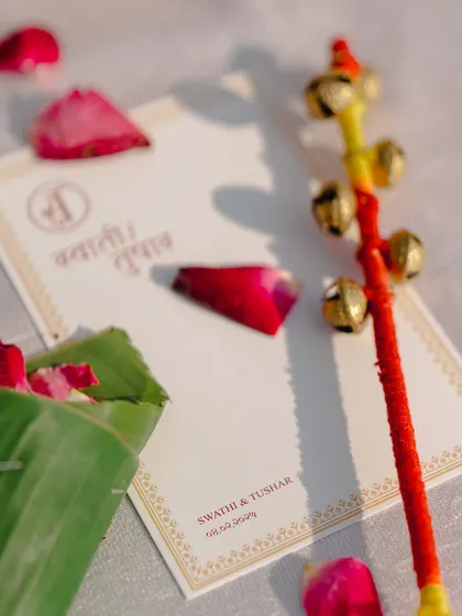 Another look at the personalized stationery, showing the couple's monogram and event details.