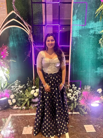 A full view of the elegant lehenga with its unique corset-style blouse and polka dot skirt. It's a perfect blend of modern design and traditional flair.