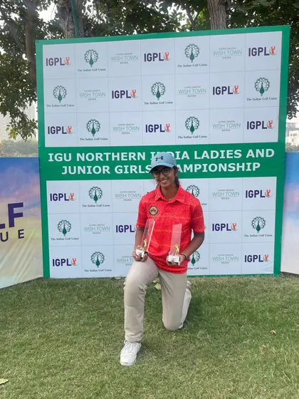 Kashika Misra proudly displays her trophies after a phenomenal win at the IGU Northern India Ladies and Junior Championship. Her incredible 11-under-par total is a testament to her skill and mental fortitude.