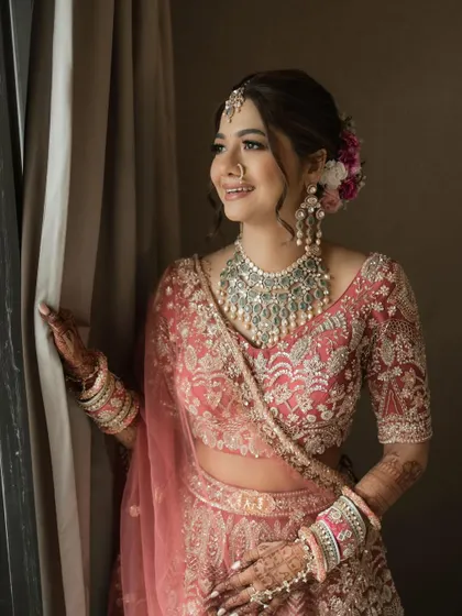 A portrait of bridal elegance. This full-length view showcases how our heritage polki set comes together with the bride's complete look, creating a picture of grace and tradition.