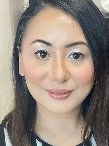 A close-up of the finished airbrush makeup look. The result is a flawless yet natural finish that enhances her features, perfect for clients who want a lightweight feel.