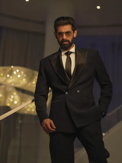 For Rana Daggubati at the IIFA Awards, I aimed for a look of pure, classic Hollywood glamour. This shot captures the sharp lines of his custom Raamz Label tuxedo against the architectural details of the venue.