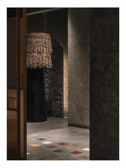 The 'Zen Garden' spaces in our 'Frozen' retail design. Each area features a unique, obscure object, like this large floor lamp with a thatch shade, designed to create curiosity and conversation.