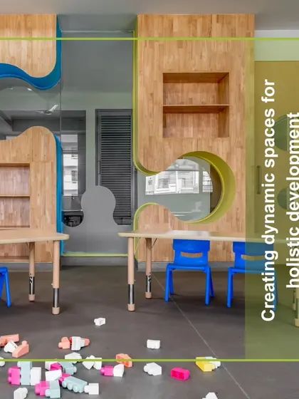 A classroom at Amity International School, Mohali, where puzzle-piece walls and adjustable-height tables create a dynamic space for holistic development. The blocks on the floor emphasize the hands-on, playful nature of learning.