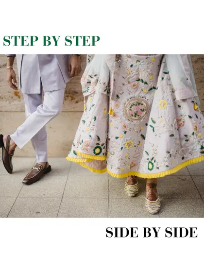 "Step by step, side by side." A creative shot focusing on the couple's coordinated footwear and the beautiful embroidery of the bride's lehenga.