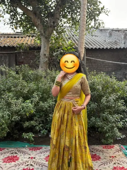 A happy client in a beautiful yellow printed lehenga, perfect for a Haldi function. The lightweight fabric makes it easy to move and dance in.