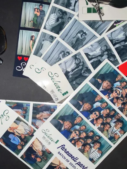 Capturing memories at a farewell party. These photo strips become treasured keepsakes of college life and friendships.