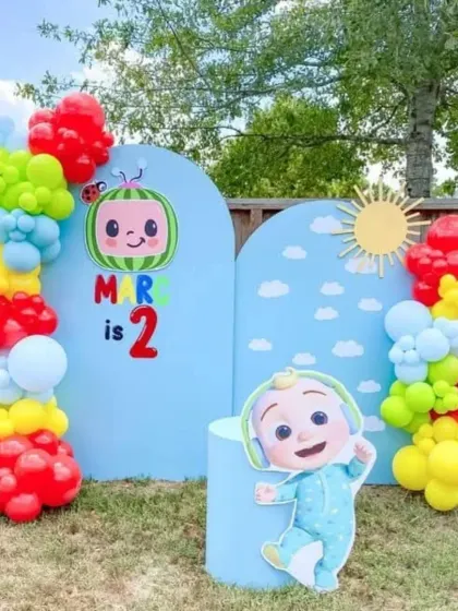 A simple and sweet outdoor Cocomelon setup, perfect for a garden party for a 2-year-old.
