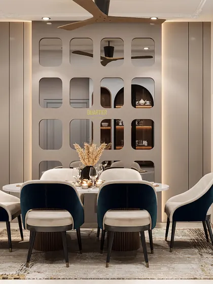 This contemporary dining area design for Apex D'Rio features a stunning tinted mirror panel with a PU finish. A mandir with glass shutters is seamlessly integrated into the design, blending spirituality with modern aesthetics.