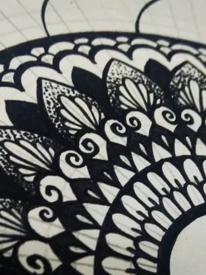 Another in-progress shot, showing the outer layers of a mandala being drawn. It's a slow and steady process of filling in each section, which is what makes it so meditative.