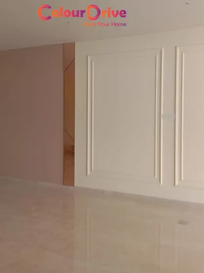 This image shows a combination of a soft, neutral paint color and classic wall beading painted in a crisp off-white. This technique adds architectural detail and a timeless, elegant feel to any room.