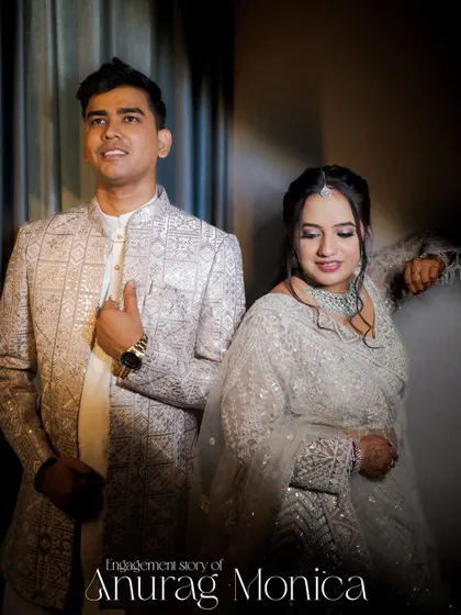 A stylish portrait of the couple, posed elegantly. This shot showcases their coordinated outfits and captures a sense of modern sophistication.